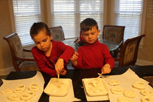 Dipping the Pretzels into Log House's Vanilla Candiquik 