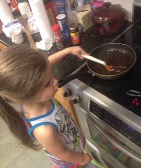 Ammon Stirs the General Tso sauce 